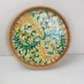 Detail view of handmade rattan tray with colorful shell leaf mosaic pattern for home decor. - Round 30cm