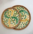 Hand-woven round rattan tray with green and yellow shell mosaic leaf pattern, elegant table decor. - Set of 2 Round