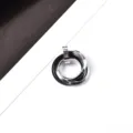 Detail view of the men's titanium steel three-ring interlocking pendant necklace, black and silver. - Pendant Only (Without Chain) (Black)