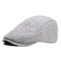 Classic grey tweed flat cap detail shot, showcasing the fine fabric texture and stylish brim shape. - Off White