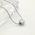 Detailed shot of minimalist stainless steel cube pendant necklace with sleek snake chain. - Polished Cube - 45cm+5cm