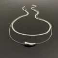 Detailed view of the double layer titanium steel snake chain necklace with smooth pendant. - Double Layer Cylinder Pendant Necklace