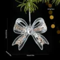 Pendentif de Noël nœud en acrylique transparent avec paillettes et centre en cristal. - Papillon Style D