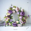 Detailed close-up of artificial peony and rose wreath for front door and wedding decor. - Style A