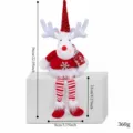 Poupée renne de Noël en peluche avec longues jambes rayées et chapeau rouge à paillettes. - Poupée de renne au chapeau de paillettes
