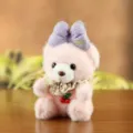 Pink plush teddy bear keychain with purple bow and lace collar, cute bag pendant toy. - Pink