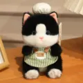 Simpatico ciondolo in peluche di gatto nero e bianco con cappello da cuoco e grembiule verde, bambola. - Ciondolo Peluche Gattino / Circa 18cm Autorizzato / Bianco e nero
