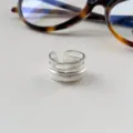 Detailed shot of a stylish multi-layered open silver ring with a sophisticated matte finish. - Open Adjustable / Multi-Layer Open Style (JZ5633)