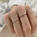 Delicate silver color cross ring and sparkling rhinestone band detail shot, elegant hand wear. - Double Layer Cross Rhinestone Style (JZ5641)