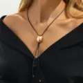 Gold oval pendant black cord necklace detailed close-up view showcasing modern style. - Oval Pendant Style (07661) / Gold