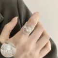 Adjustable open silver daisy ring, hollow sunburst finger jewelry for women, ins minimalist style - Hollow Daisy Geometric Style (JZ5624)
