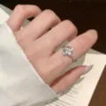 Dainty silver ring featuring a chic fleur-de-lis motif and tiny zircon, open adjustable design. - Iris Flower Three-Dimensional Style (JZ5389)