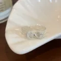 Detail shot of sweet bow silver open ring with clear crystal and delicate lace edge design. - Open Adjustable / Bowknot Lace Open Ring (JZ5619)