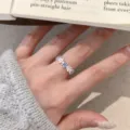 Silver tone clover flower ring with sparkling white and blue zirconia stones for women variant - Clover Blue White Rhinestone Style (JZ5498)
