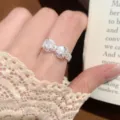 Silver bowknot ring with sparkling cubic zirconia, elegant open design for women's daily wear. - Open Adjustable / Exquisite Bowknot Style (JZ5619)