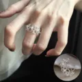 Offener Perlen Metallring in durchbrochenem Design als edle Variante fuer stilvollen Fingerschmuck - Hohlperlen-Inlay-Stil (JZ5621)