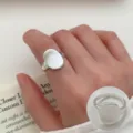 Minimalist silver open ring with irregular oval face, chic geometric design for women. - Fashion Geometric Micro-Frosted Style (JZ5201) / Open Adjustable