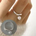 Stunning silver geometric open ring with elegant dangling pearl pendant, chic style. - Geometric Pearl Pendant Ring(JZ6883)