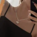 Stunning silver double-layer necklace featuring a chic puffy heart pendant and elegant chains. - Spliced Thick Thin Bead Chain 3D Heart Necklace (XL1395)
