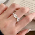 Close up detail of the textured silver wavy ring worn on finger, elegant niche daily jewelry style. - Adjustable / JZ5493-1