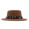 Detailed view of a chic camel flat-top wool hat featuring a black pearl flower decorated ribbon band. - 57cm / Brown