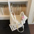 Sweet style minimalist shoulder bag for women, commuter crossbody bag with cute charm. - Pink Bow Dog Head / Off White