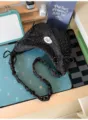 Black polka dot crescent shoulder bag with sweet bow accents and stylish scrunchie strap. - Black (No Pendant)
