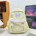 Cute low saturation milky yellow casual student backpack with plush pendant and bow embroidery. - Long Legged White Fur Ball / Pink