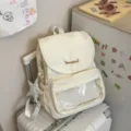 Mochila suave amarillo leche para mujer casual diaria con bolsillo frontal transparente variante - Con Colgante / Blanco