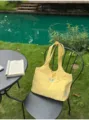 Soft yellow tote bag with cute blue animal embroidery, perfect for daily casual commuting use. - Yellow