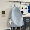 Zaino casual azzurro chiaro con stampa di stelle argentate, leggero per viaggi e scuola. - Blu + Pentagramma a Pois