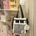 Bolso ita de lunares blancos y negros con bolsillo de malla transparente y estuche redondo. - Bolso de Hombro Negro Con 2 Colgantes