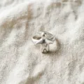 Silver color adjustable ring featuring a cute puppet shape with heart detail, stylish and chic. - Hollow Heart Figure Style (JZ5586-1) / Open Adjustable
