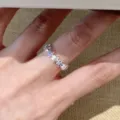 Close-up detail of silver star ring with blue gemstones, elegant minimalist finger jewelry. - Adjustable / JZ5491