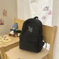 Black plaid student backpack with white embroidery, lightweight and stylish daily school bag for girls. - S / Black