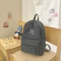 Dark grey plaid backpack with front zipper pocket and white embroidery for daily use. - S / Dark Gray