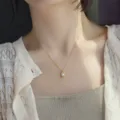 Elegant gold chain necklace with a delicate pearl pendant, elegant clavicle chain design for women. - Gold Fine Chain White Bead 3D Pendant Necklace (XL1507-2)