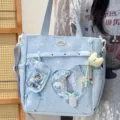 Detail view of a Japanese sweet ita bag in light blue with heart window and star patterns. - No Pendant No Transparent Window Ornaments / Blue