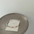 Silver beaded bracelet with colorful rainbow crystals and a cute smiley charm for women. - Smiley Crystal Bracelet (SL3592)