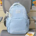 Cute blue star print backpack with delicate white lace trim, perfect for daily school use. - Pearl Bowknot Pendant / Blue
