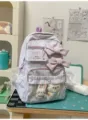 Purple striped student backpack with cute bows and transparent plush pocket for daily casual use - Gluttonous Bear + Carrot Rabbit Pendant / Purple