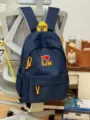 Navy blue contrast backpack with yellow straps and cute front embroidery for daily school use. - No Pendant / Navy Blue