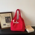 Red polka dot canvas shoulder bag casual tote handbag with pearl strap and vintage aesthetic. - With Charm / Red