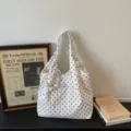 Milky white polka dot canvas shoulder bag with pearl strap for casual daily use. - With Charm / White