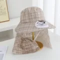 Detail shot of beige plaid sun bucket hat with solar fan and neck flap on display stand. - Solar + Rechargeable 600MA / Khaki