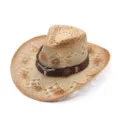 Detailed view of the straw cowboy hat with vintage distressed finish and bull skull metal decor. - Gradient Hollow Leather Band Style / Beige