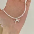 Sweet pearl necklace with a delicate silver bow pendant, elegant clavicle chain for women fashion. - XL2076