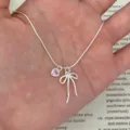 Dainty silver bow necklace with pink heart pendant, sweet style jewelry for women and girls. - XL2047