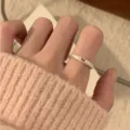Minimalist open finger ring for women, stylish silver metal band with cute hollow heart cutout design. - JZ7413