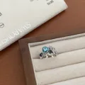 Vintage silver ring with blue crystal and floral design, stylish open adjustable fashion jewelry. - JZ6044